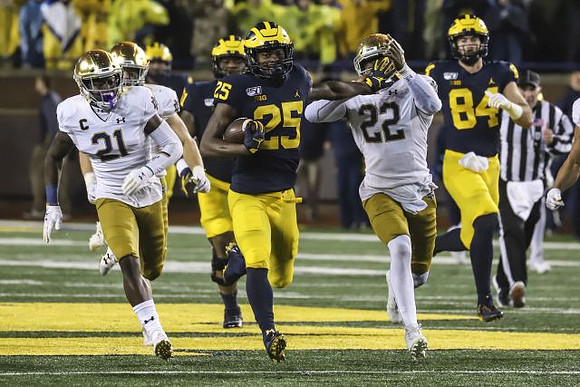 Cesar Ruiz (51), Hassan Haskins (25), and Sean McKeon (84)