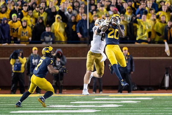 Khaleke Hudson (7) and Brad Hawkins (20)