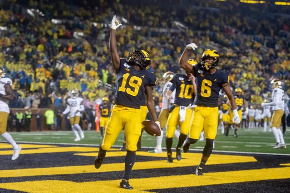 Mike Sainristil (19), Dylan McCaffrey (10), and Cornelius Johnson (6)