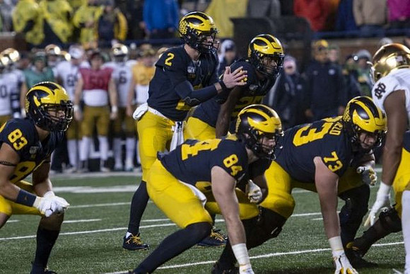 Erick All (83), Shea Patterson (2), Sean McKeon (84), Hassan Haskins (25), and Jalen Mayfield (73)