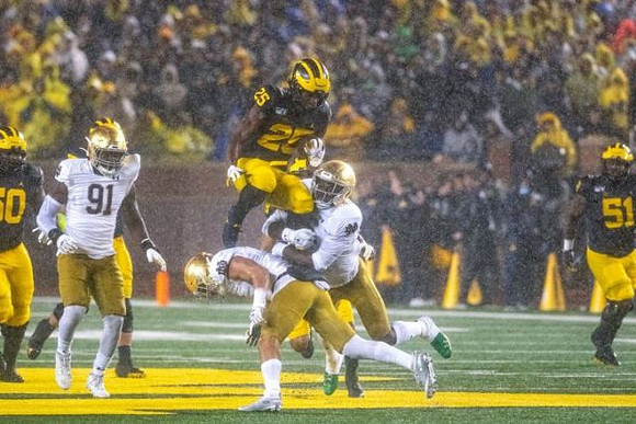 Michael Onwenu (50), Hassan Haskins (25), and Cesar Ruiz (51)