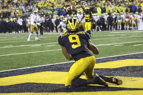 Donovan Peoples-Jones (9) and Hassan Haskins (25)