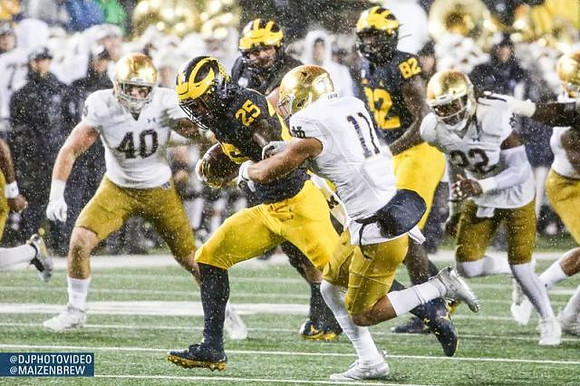 Hassan Haskins (25) and Nick Eubanks (82)