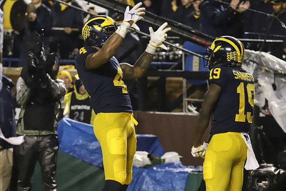 Nico Collins (4) and Mike Sainristil (19)