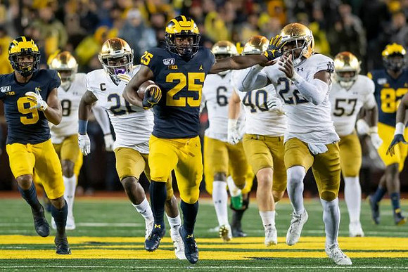 Donovan Peoples-Jones (9), Hassan Haskins (25), and Nick Eubanks (82)