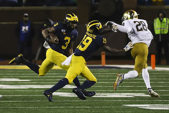 Christian Turner (3) and Mike Sainristil (19)