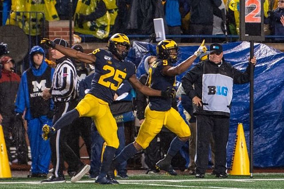 Hassan Haskins (25) and Donovan Peoples-Jones (9)