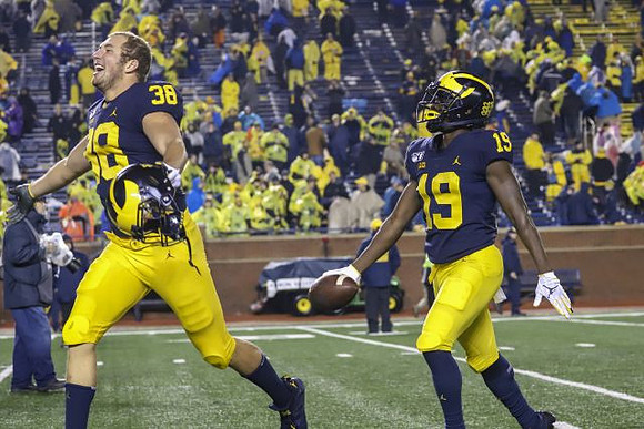 Joseph Files (38) and Mike Sainristil (19)