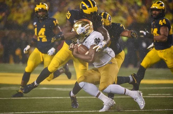 Josh Metellus (14), Brad Hawkins (20), Khaleke Hudson (7), and Cameron McGrone (44)