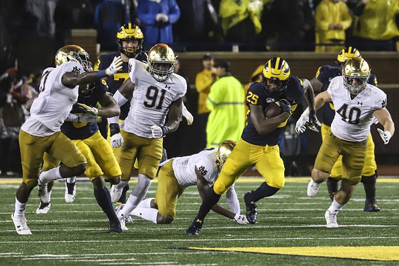 Donovan Peoples-Jones (9), Jalen Mayfield (73), Hassan Haskins (25), and Michael Onwenu (50)