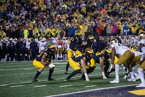 Erick All (83), Shea Patterson (2), Sean McKeon (84), Hassan Haskins (25), and Jalen Mayfield (73)
