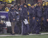 Jim Harbaugh and Shaun Nua