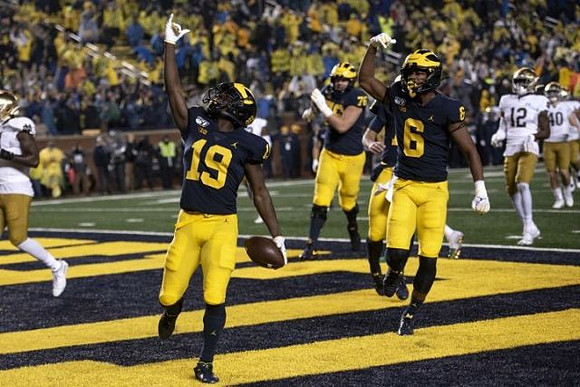 Mike Sainristil (19), Ryan Hayes (76), and Cornelius Johnson (6)