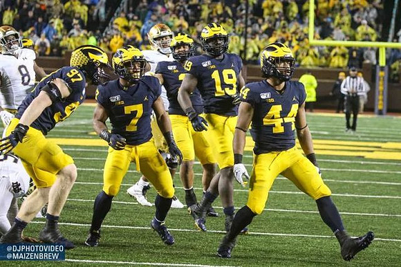 Aidan Hutchinson (97), Khaleke Hudson (7), Carlo Kemp (2), Kwity Paye (19), and Cameron McGrone (44)