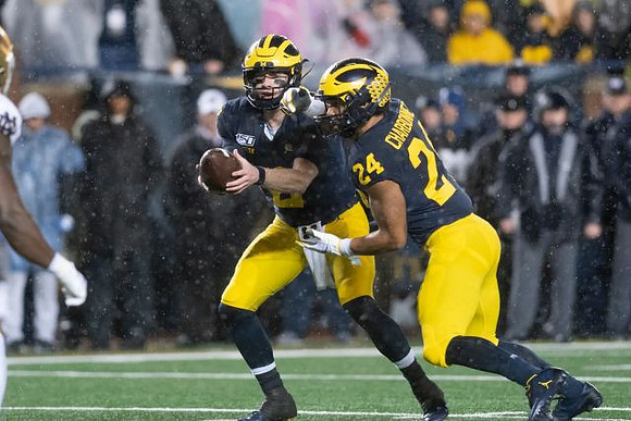 Shea Patterson (2) and Zach Charbonnet (24)