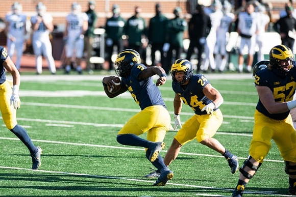 Joe Milton (5), Zach Charbonnet (24), and Karsen Barnhart (52)