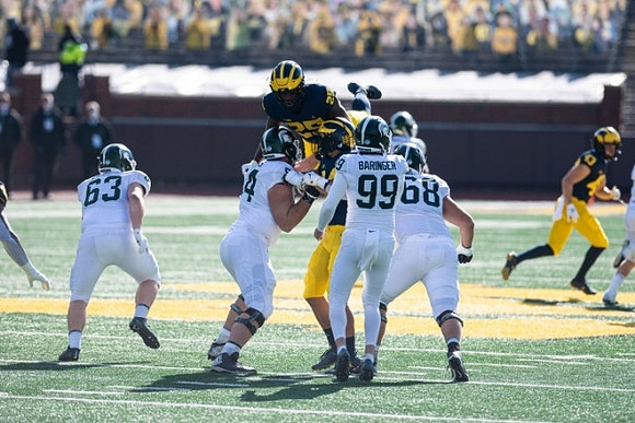 Hassan Haskins (25) and Jake McCurry (43)