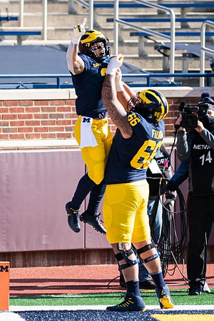 Blake Corum (2) and Chuck Filiaga (66)