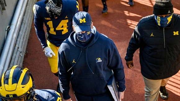 Roman Wilson (14) and Jim Harbaugh