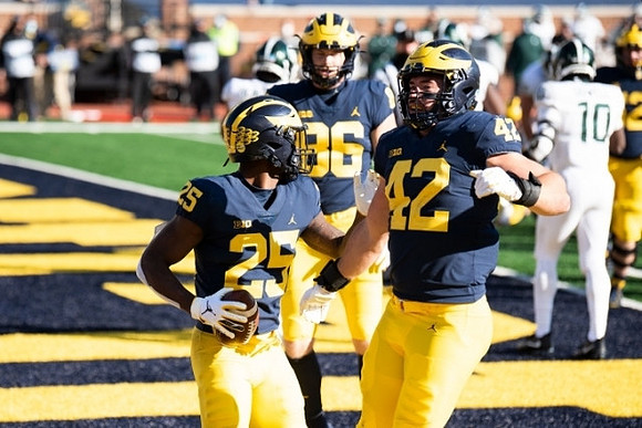 Hassan Haskins (25), Ben Mason (42), and Luke Schoonmaker (86)
