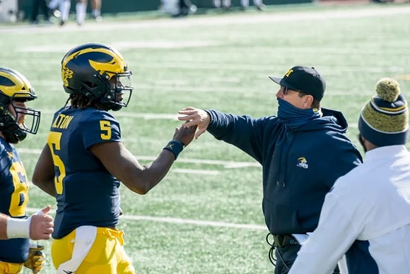 Joe Milton (5) and Jim Harbaugh