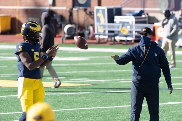 Joe Milton (5) and Jim Harbaugh