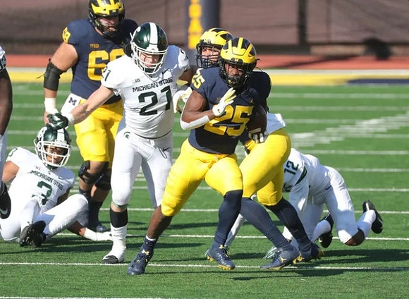 Andrew Vastardis (68) and Hassan Haskins (25)