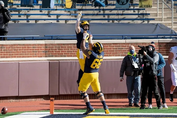 Blake Corum (2) and Chuck Filiaga (66)