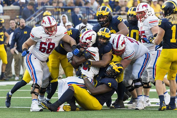 Devin Gil (36), Rashan Gary (3), Carlo Kemp (2), Bryan Mone (90), Devin Bush (10), and Chase Winovich (15)