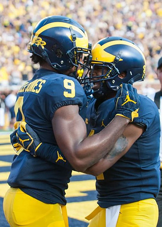 Donovan Peoples-Jones (9) and Nick Eubanks (82)