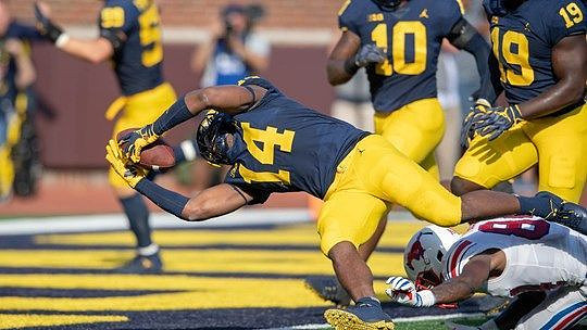 Noah Furbush (59), Josh Metellus (14), Devin Bush (10), and Kwity Paye (19)