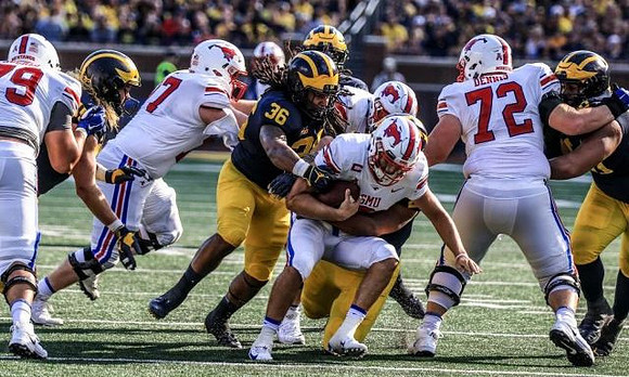 Chase Winovich (15) and Devin Gil (36)