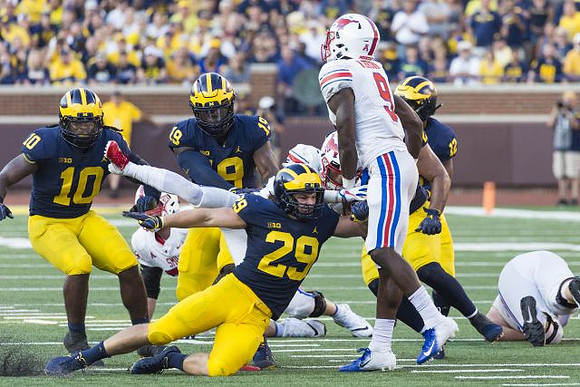 Devin Bush (10), Kwity Paye (19), Jordan Glasgow (29), and Josh Ross (12)