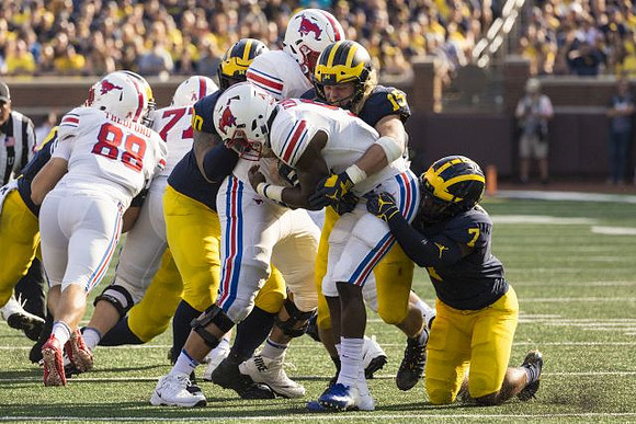 Bryan Mone (90), Chase Winovich (15), and Khaleke Hudson (7)