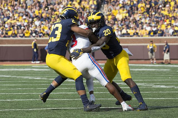 Tyree Kinnel (23) and Brad Hawkins (20)