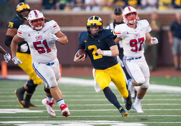 Jon Runyan Jr. (75) and Shea Patterson (2)