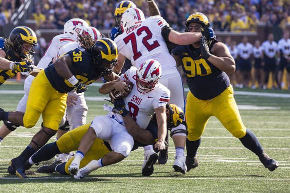 Chase Winovich (15), Devin Gil (36), Carlo Kemp (2), and Bryan Mone (90)