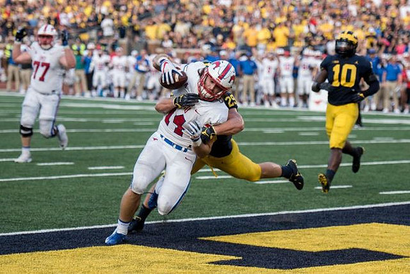 Jordan Glasgow (29) and Devin Bush (10)