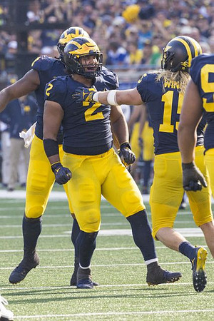 Carlo Kemp (2) and Chase Winovich (15)