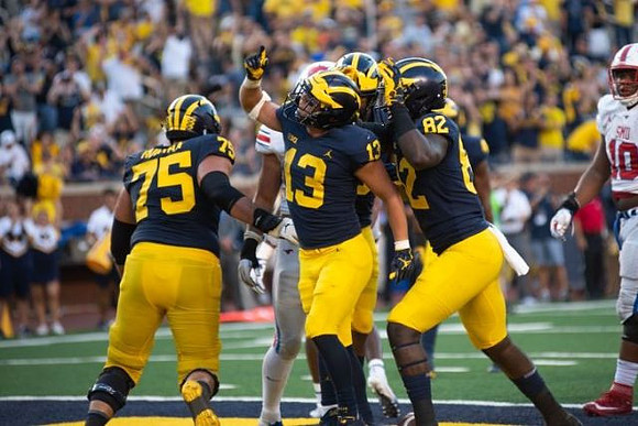 Jon Runyan Jr. (75), Tru Wilson (13), and Nick Eubanks (82)