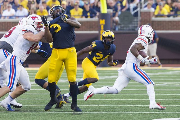 Rashan Gary (3) and Lavert Hill (24)