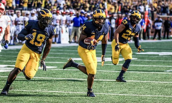 Kwity Paye (19), Josh Metellus (14), and Tyree Kinnel (23)