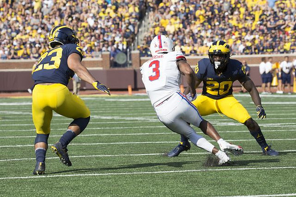 Tyree Kinnel (23) and Brad Hawkins (20)