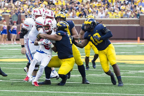 Bryan Mone (90), Carlo Kemp (2), and Devin Bush (10)