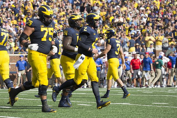 Stephen Spanellis (72), Jon Runyan Jr. (75), Cesar Ruiz (51), Shea Patterson (2), and Quinn Nordin (3)