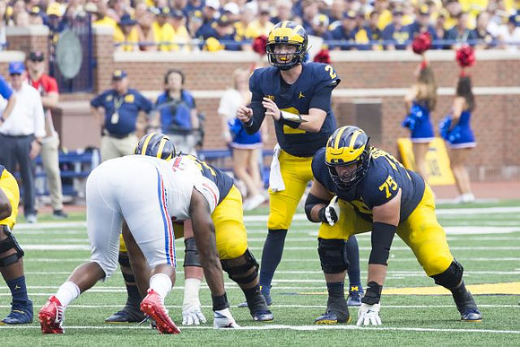 Shea Patterson (2) and Jon Runyan Jr. (75)
