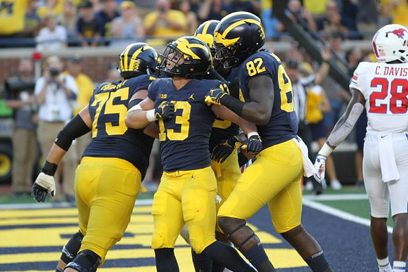 Jon Runyan Jr. (75), Tru Wilson (13), and Nick Eubanks (82)