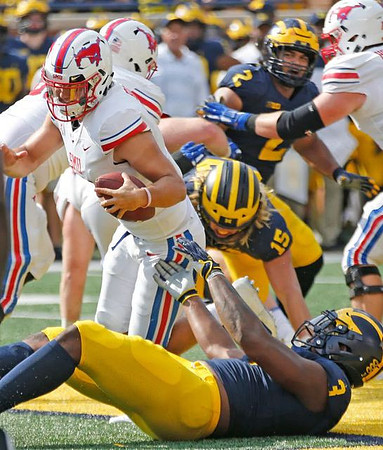 Rashan Gary (3), Chase Winovich (15), and Carlo Kemp (2)