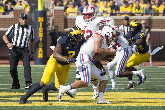 Rashan Gary (3) and Lavert Hill (24)