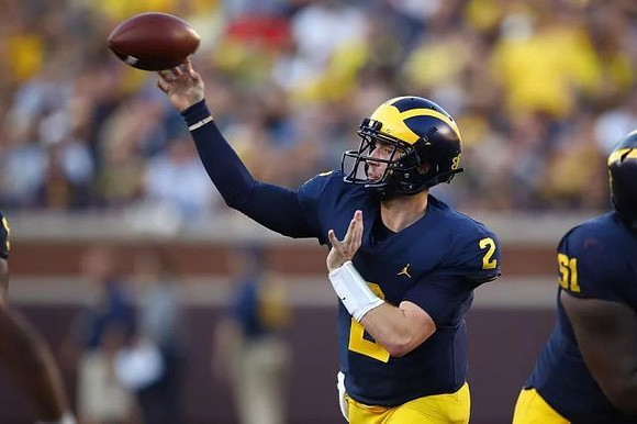 Shea Patterson (2) and Cesar Ruiz (51)